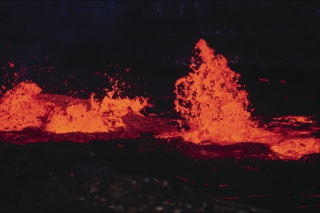volcanic eruption at night
